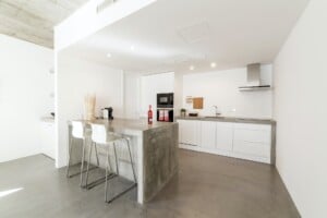 modern kitchen with gray tile floor and white wall