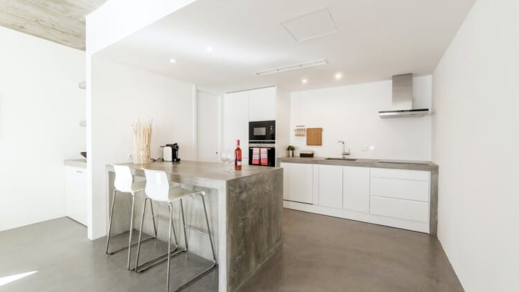 modern kitchen with gray tile floor and white wall
