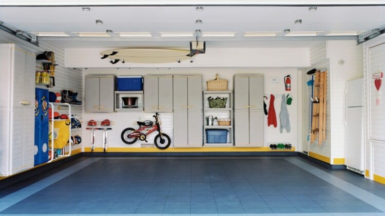 Surfboards and bicycles in empty garage
